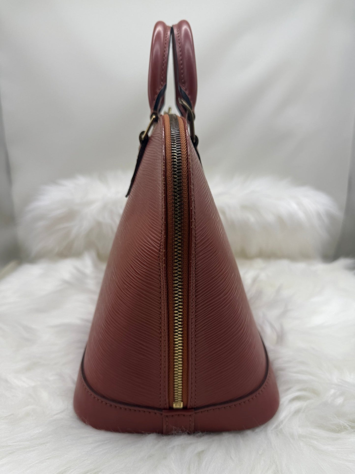 Louis Vuitton Alma PM Epi Leather in Brown - Styles via Sina