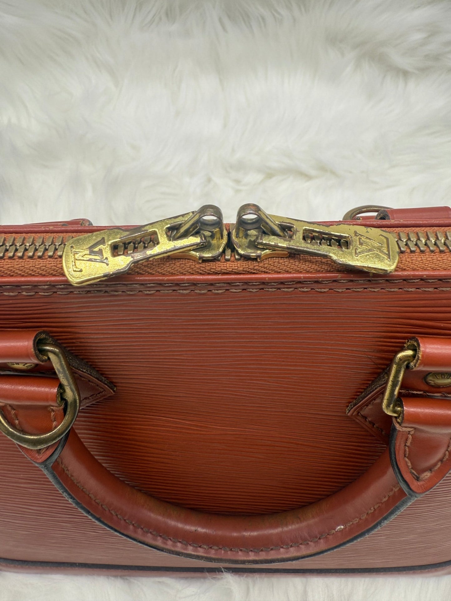 Louis Vuitton Alma PM Epi Leather in Brown - Styles via Sina