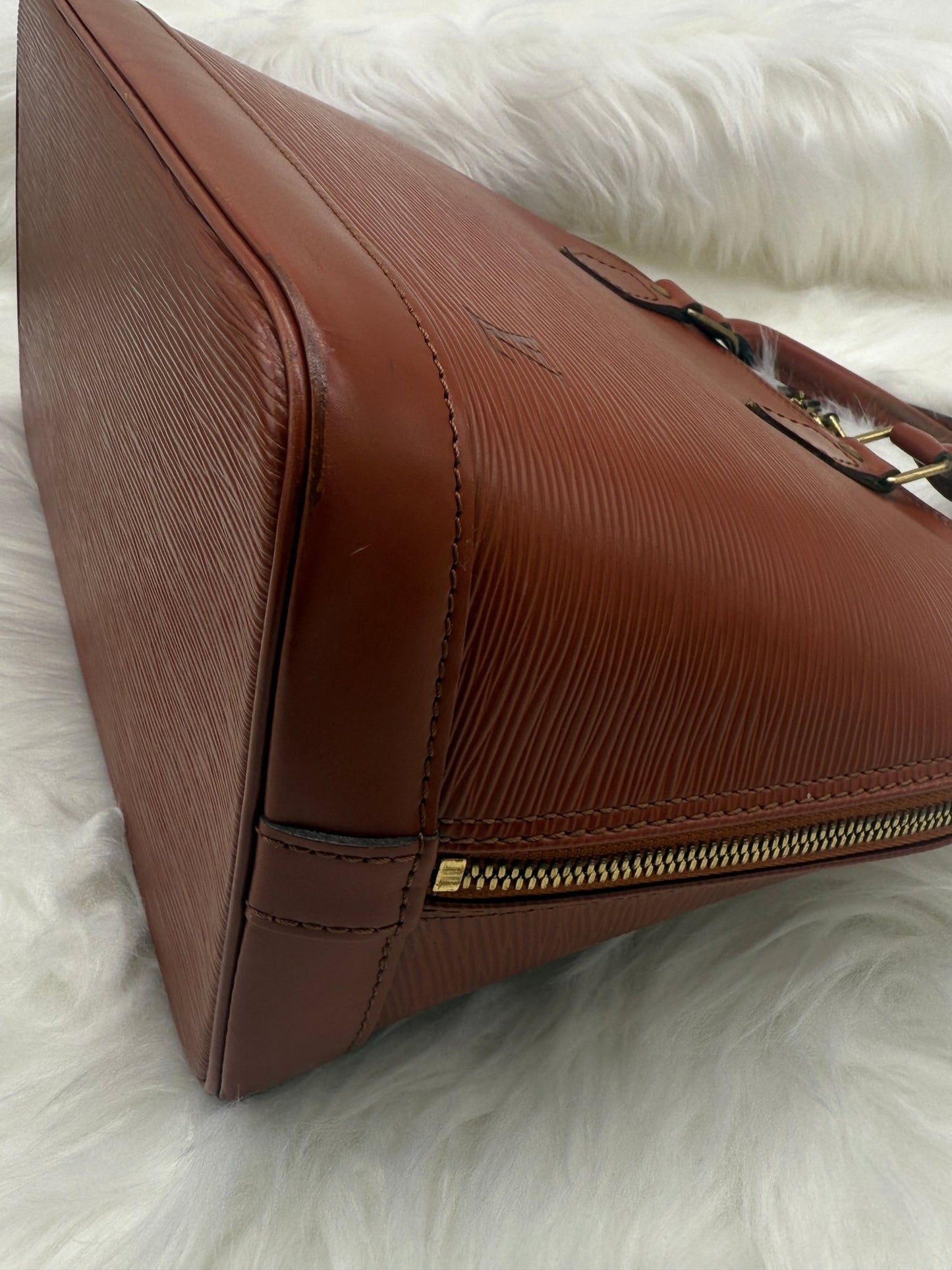 Louis Vuitton Alma PM Epi Leather in Brown - Styles via Sina