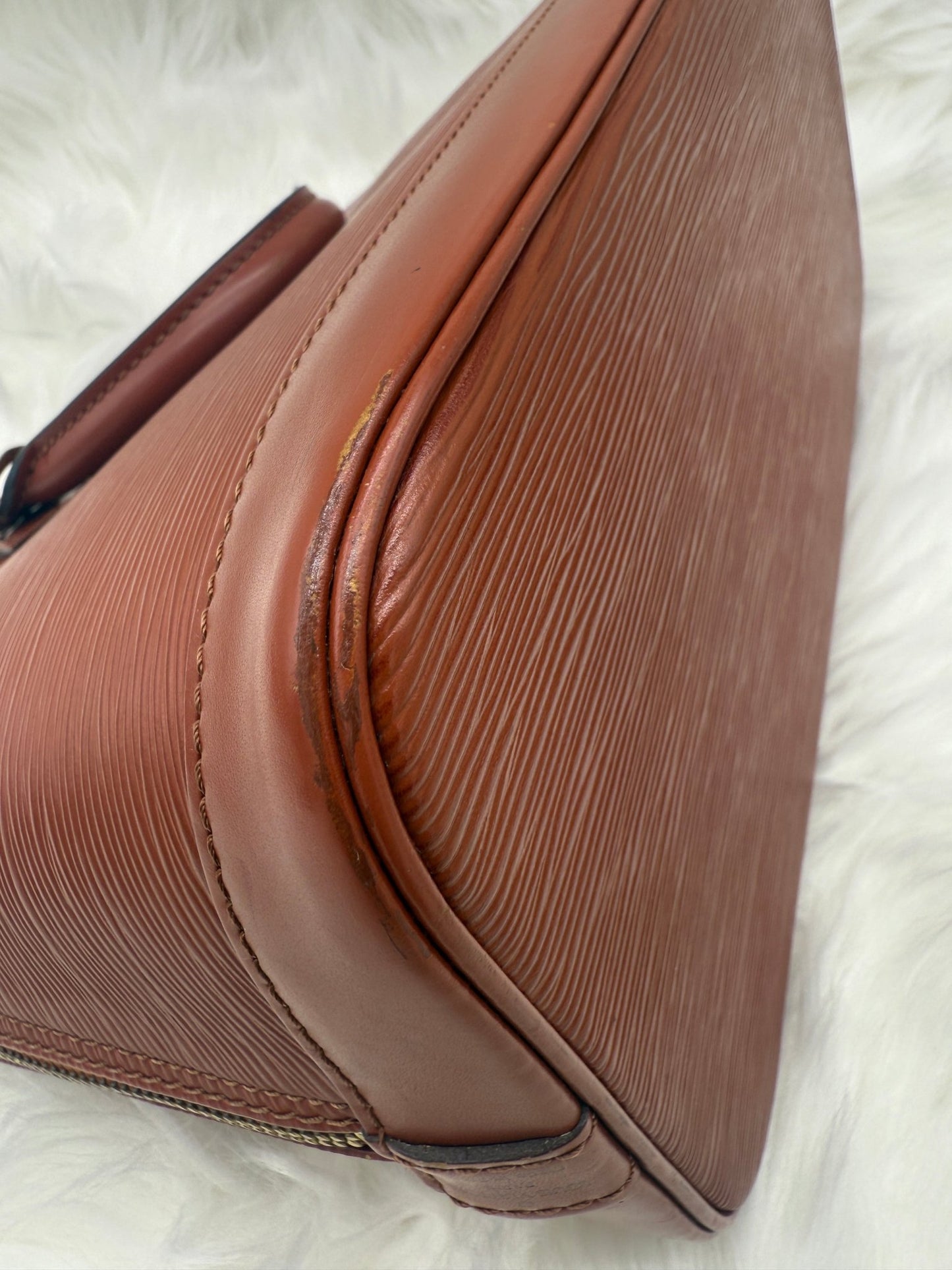 Louis Vuitton Alma PM Epi Leather in Brown - Styles via Sina