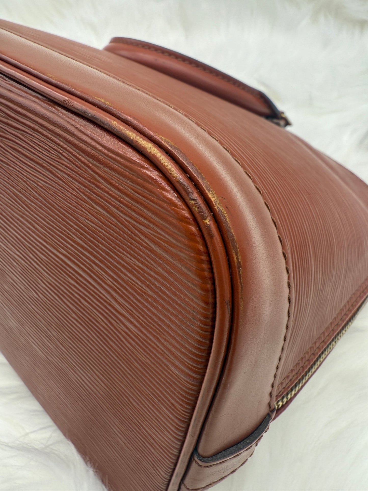 Louis Vuitton Alma PM Epi Leather in Brown - Styles via Sina