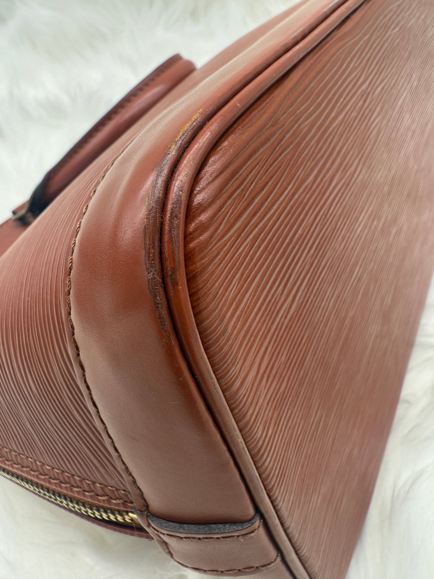 Louis Vuitton Alma PM Epi Leather in Brown - Styles via Sina