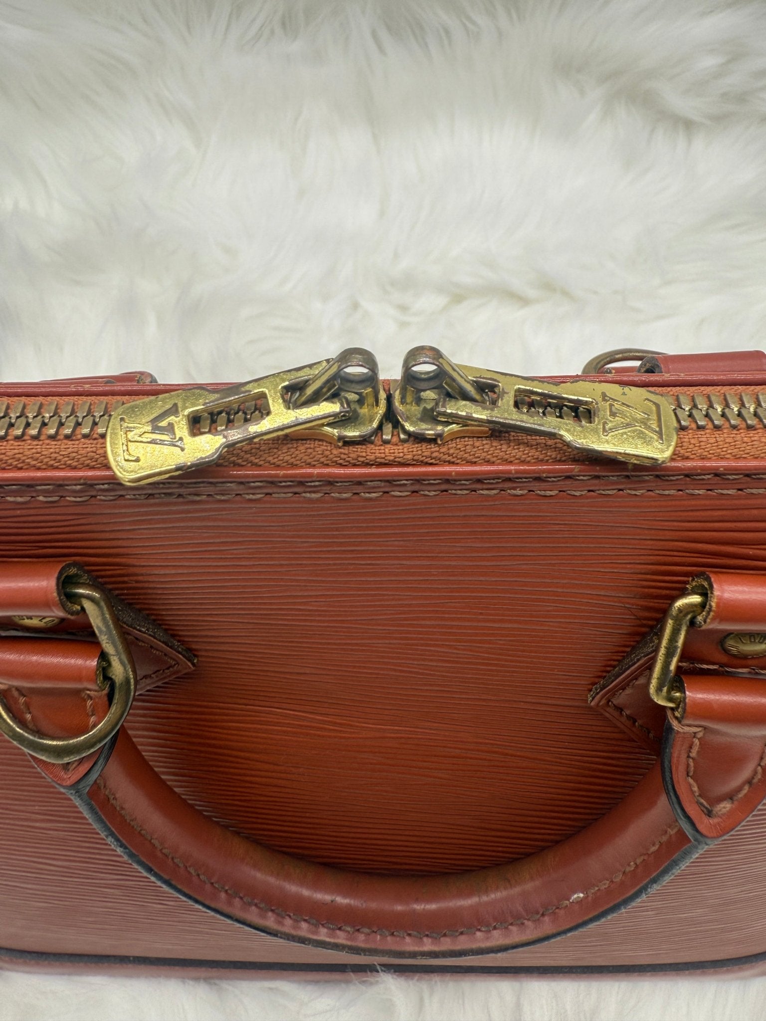 Louis Vuitton Alma PM Epi Leather in Brown - Styles via Sina