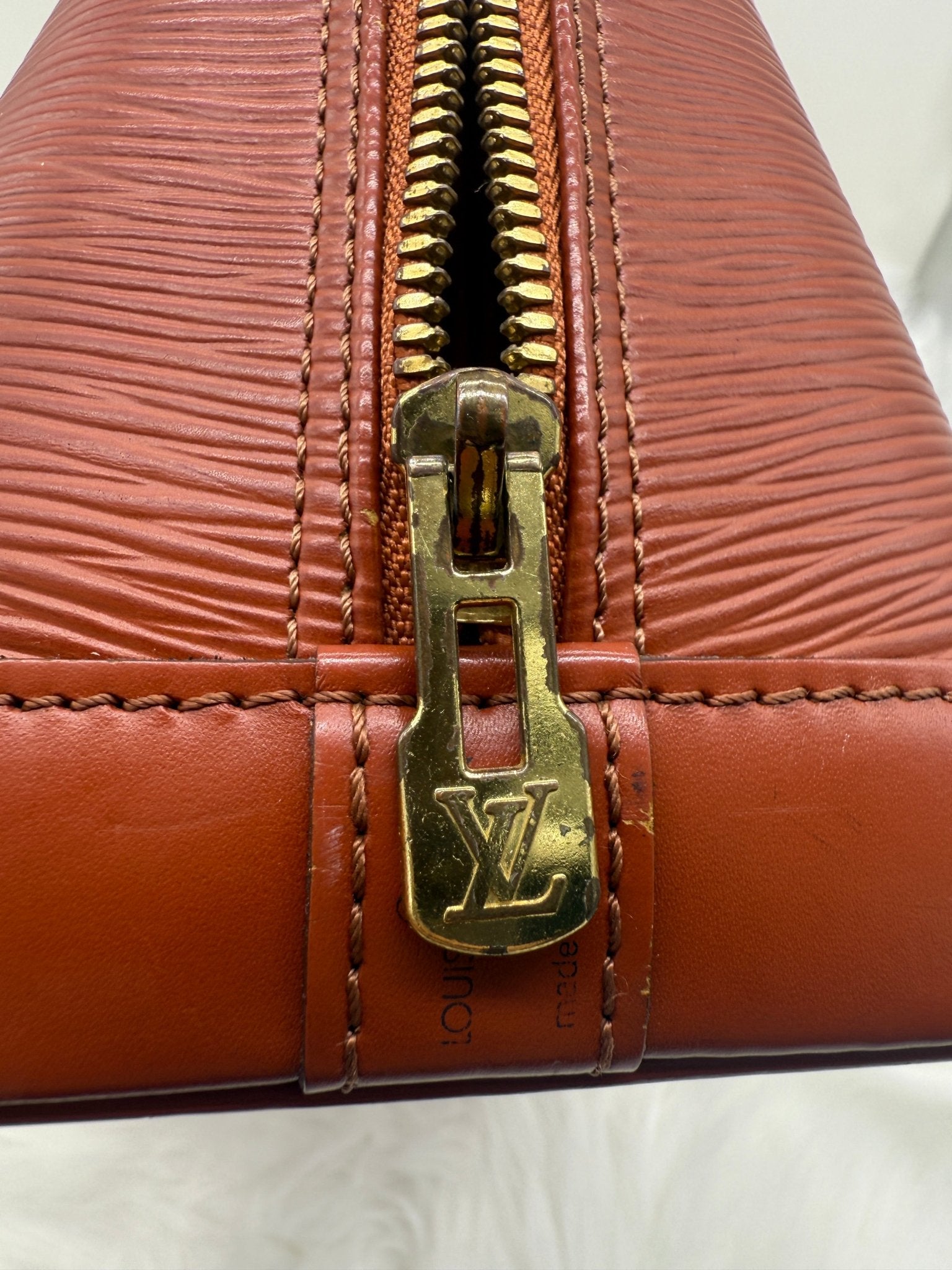 Louis Vuitton Alma PM Epi Leather in Brown - Styles via Sina