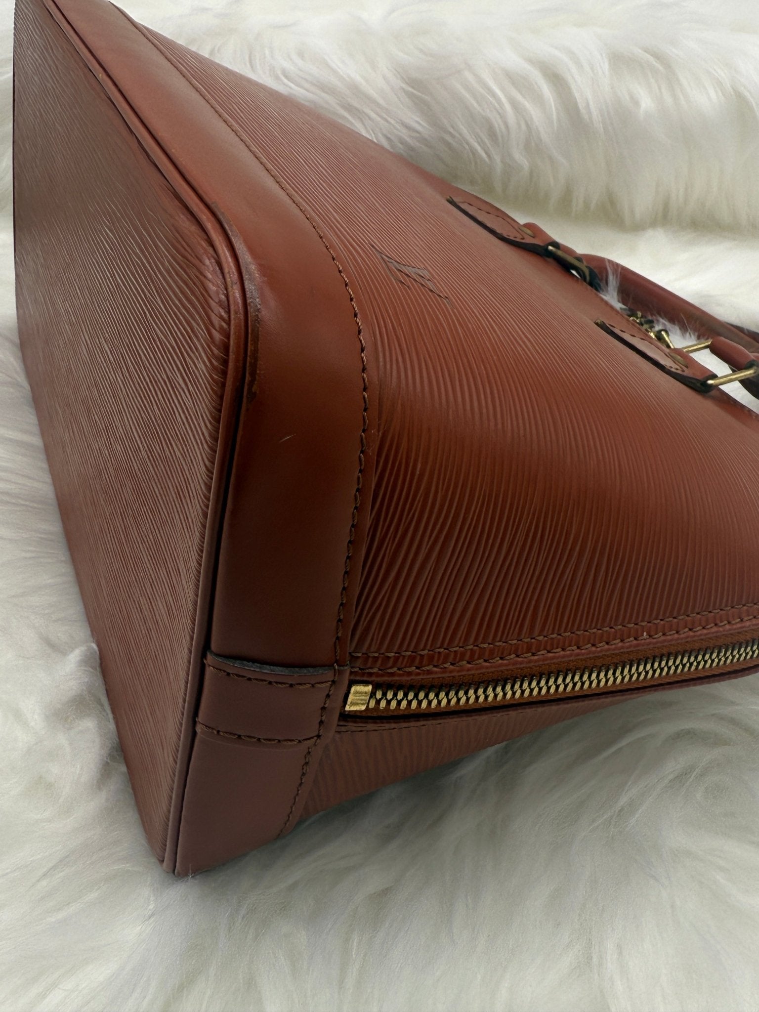 Louis Vuitton Alma PM Epi Leather in Brown - Styles via Sina
